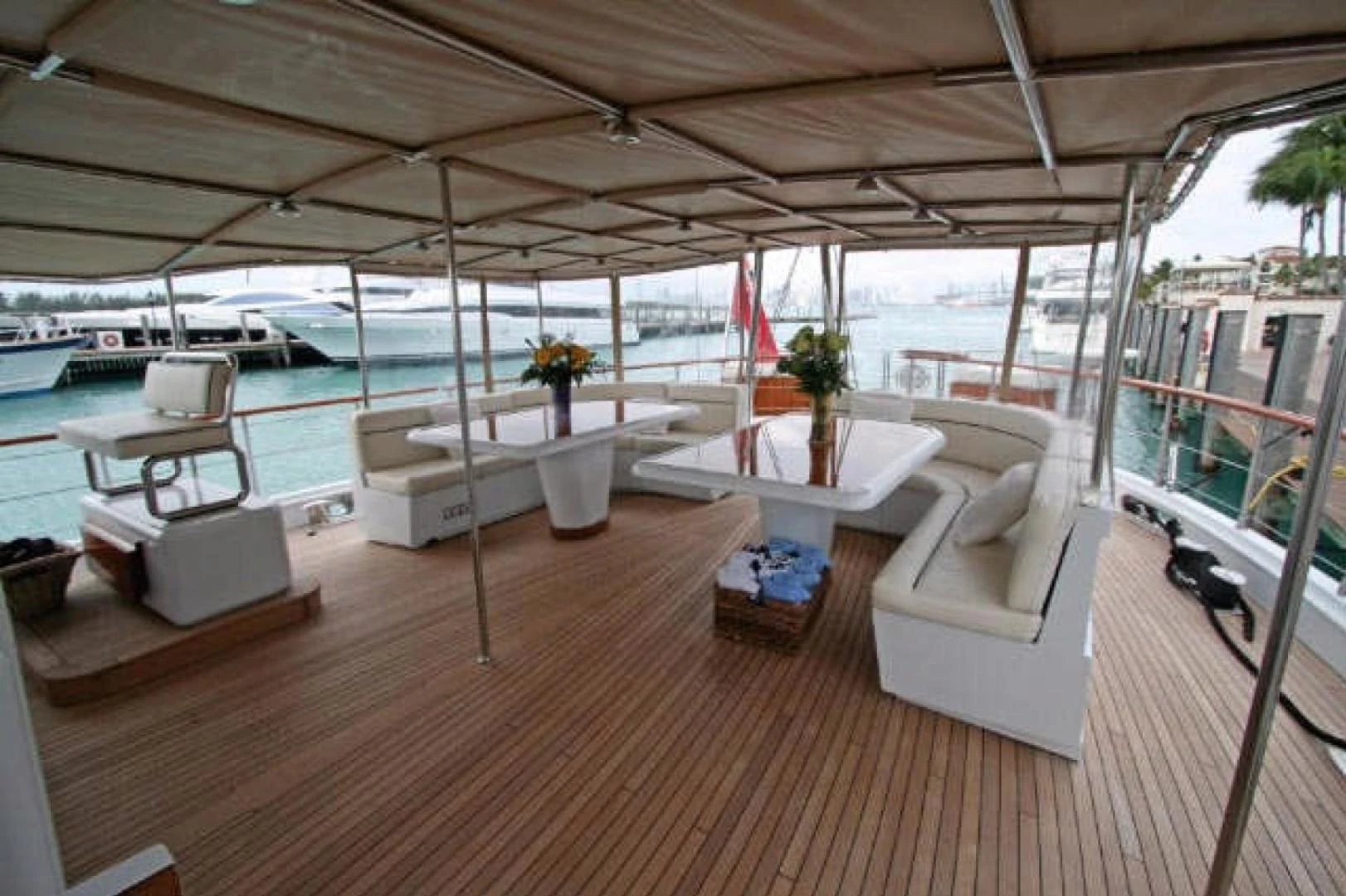 a room with a couch and a table and chairs aboard QUEEN SOUTH III Yacht for Sale