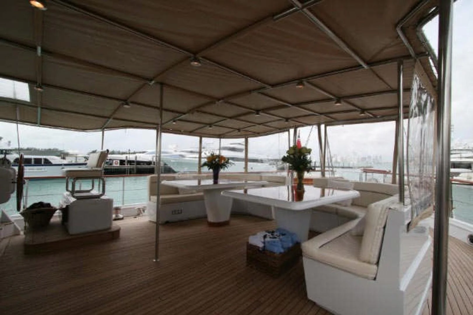 a room with a table and chairs aboard QUEEN SOUTH III Yacht for Sale