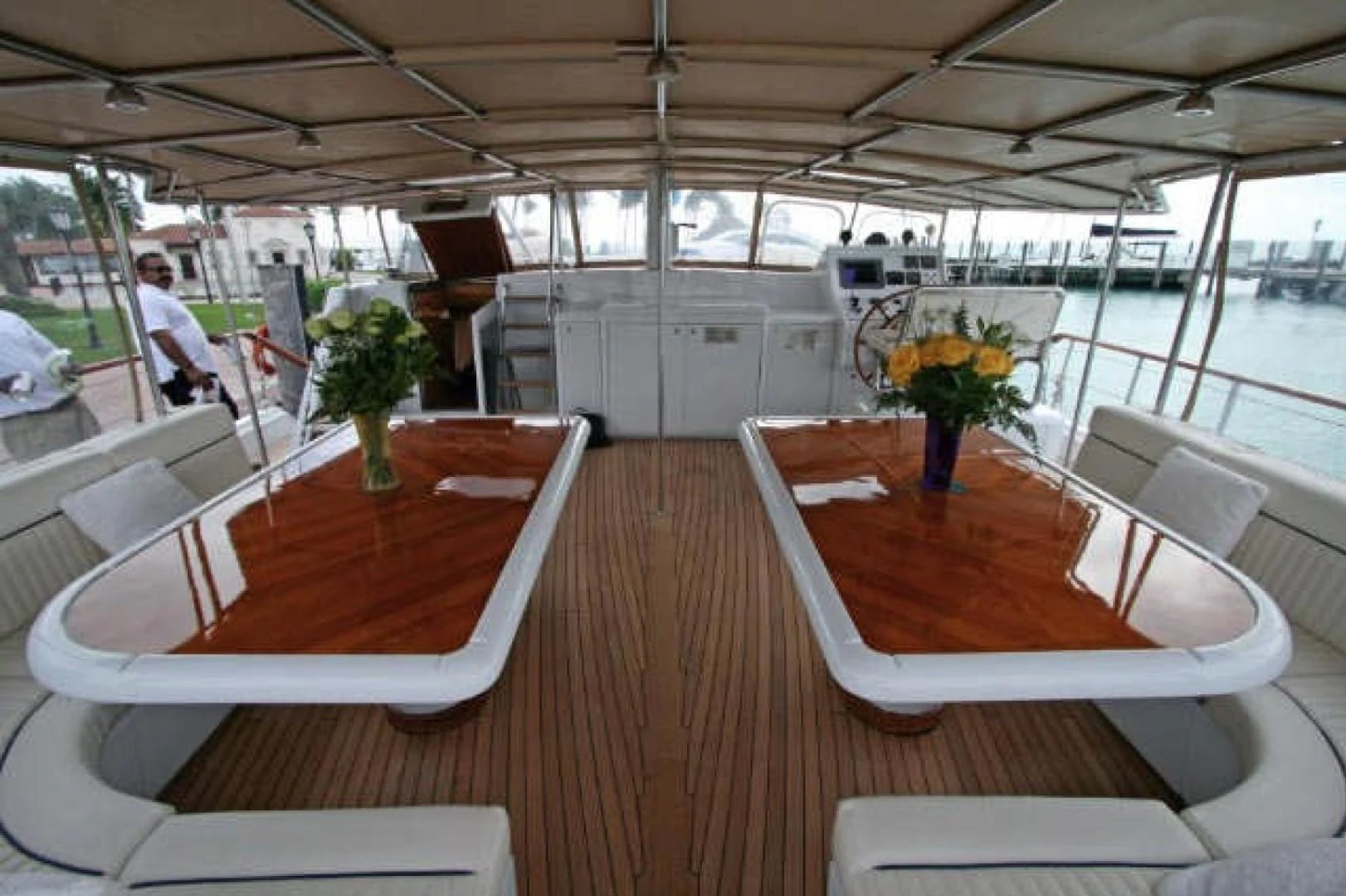 a room with tables and chairs aboard QUEEN SOUTH III Yacht for Sale