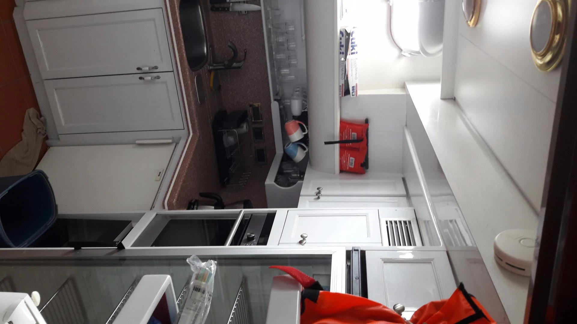 a kitchen with a sink and a mirror aboard QUEEN SOUTH III Yacht for Sale