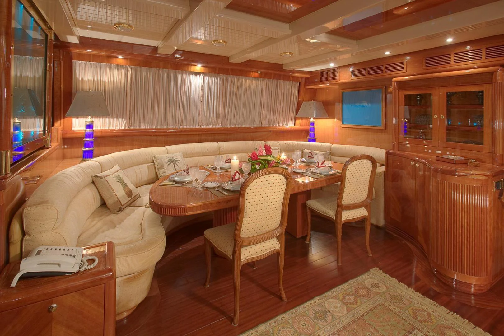 a room with a table and chairs aboard QUEEN SOUTH III Yacht for Sale