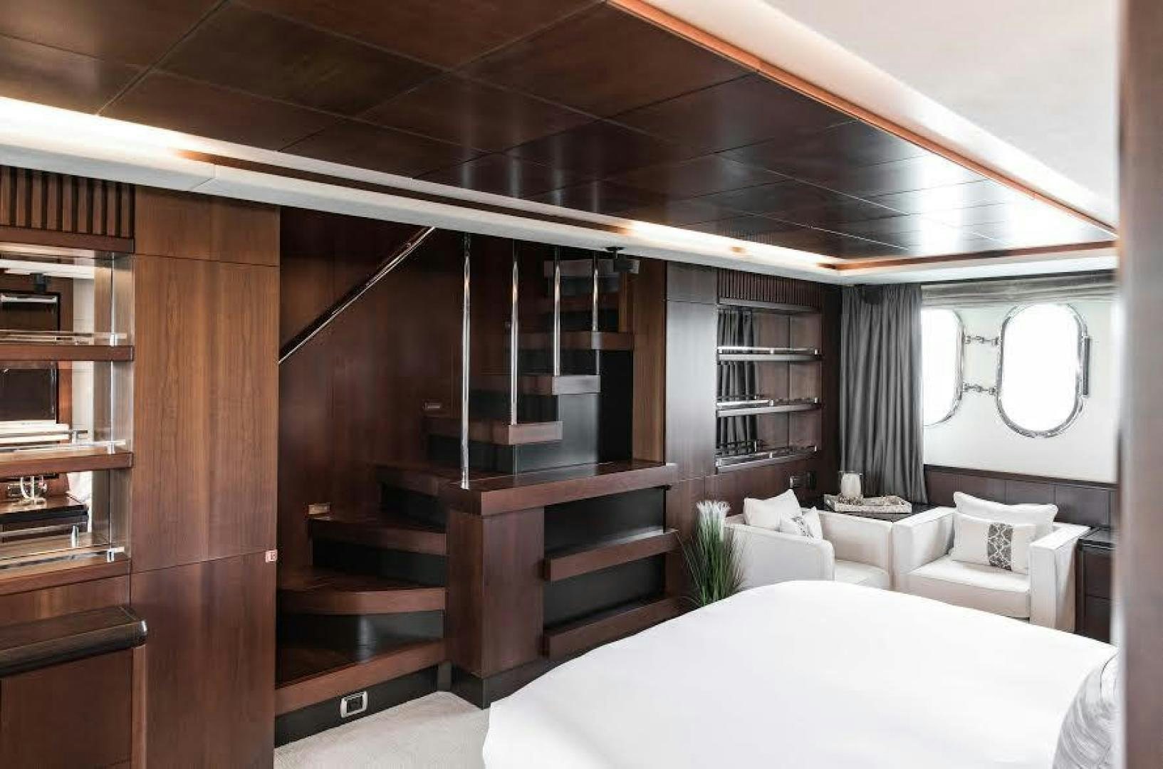 a room with a bed and a mirror aboard TAIL LIGHTS Yacht for Sale