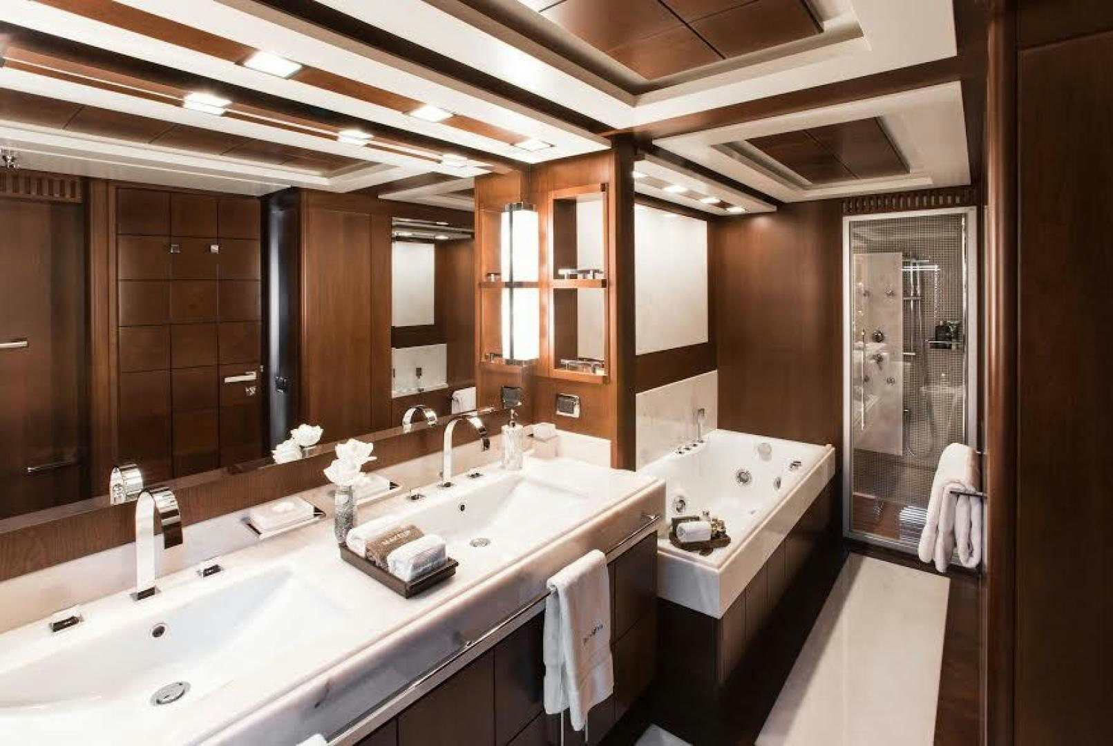 a bathroom with sinks and mirrors aboard TAIL LIGHTS Yacht for Sale