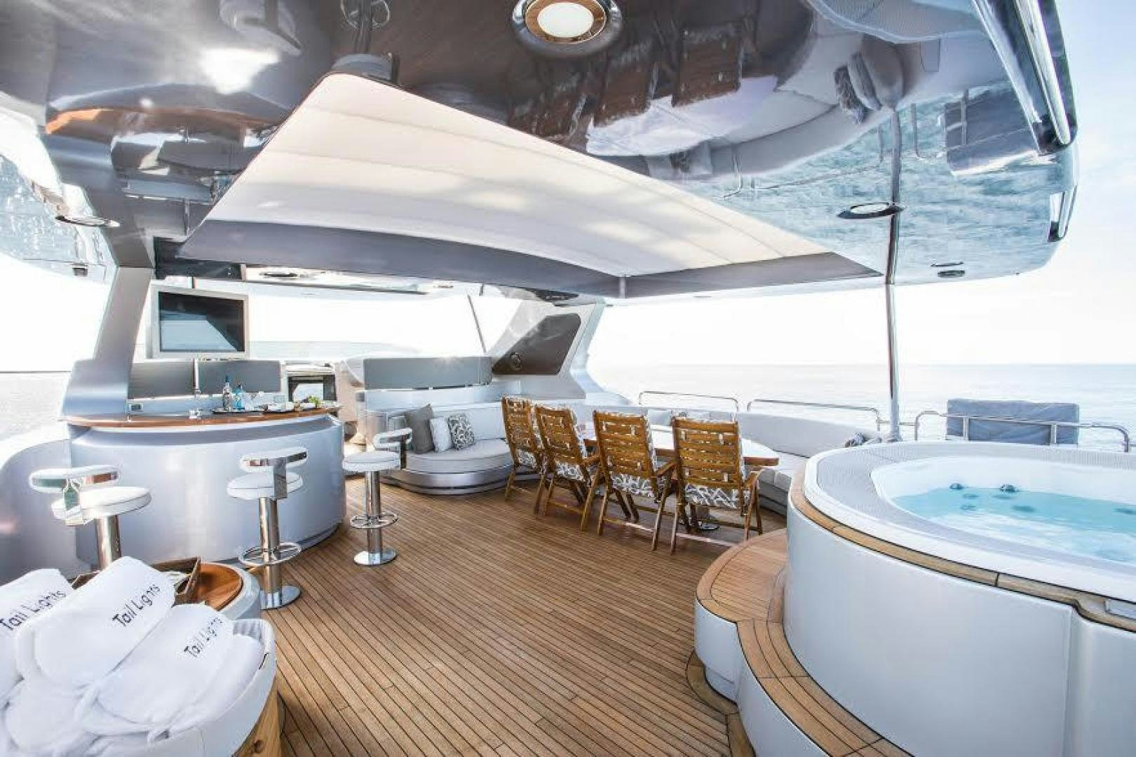 a room with tables and chairs aboard TAIL LIGHTS Yacht for Sale