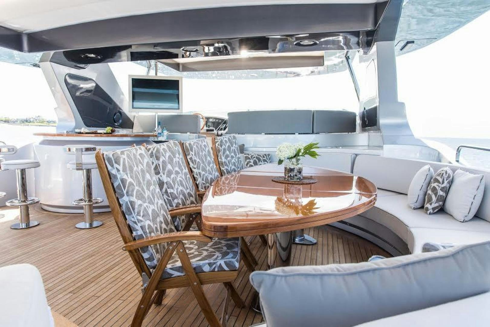 a room with a couch and a table and chairs aboard TAIL LIGHTS Yacht for Sale