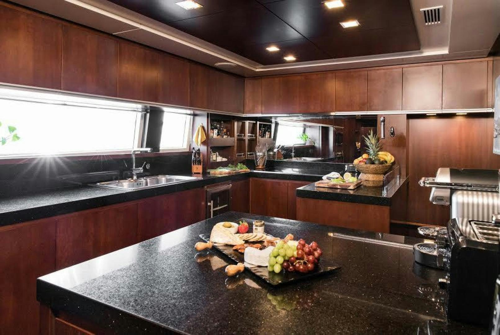 a kitchen with a large island aboard TAIL LIGHTS Yacht for Sale