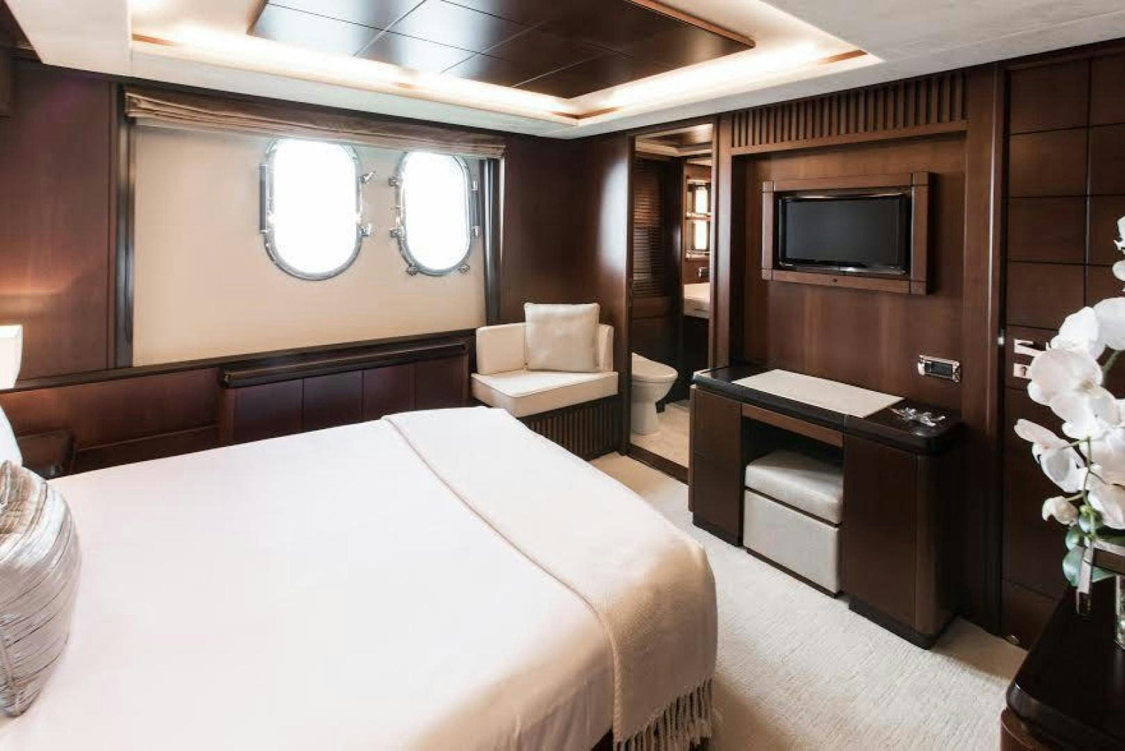 a hotel room with a bed and a tv aboard TAIL LIGHTS Yacht for Sale