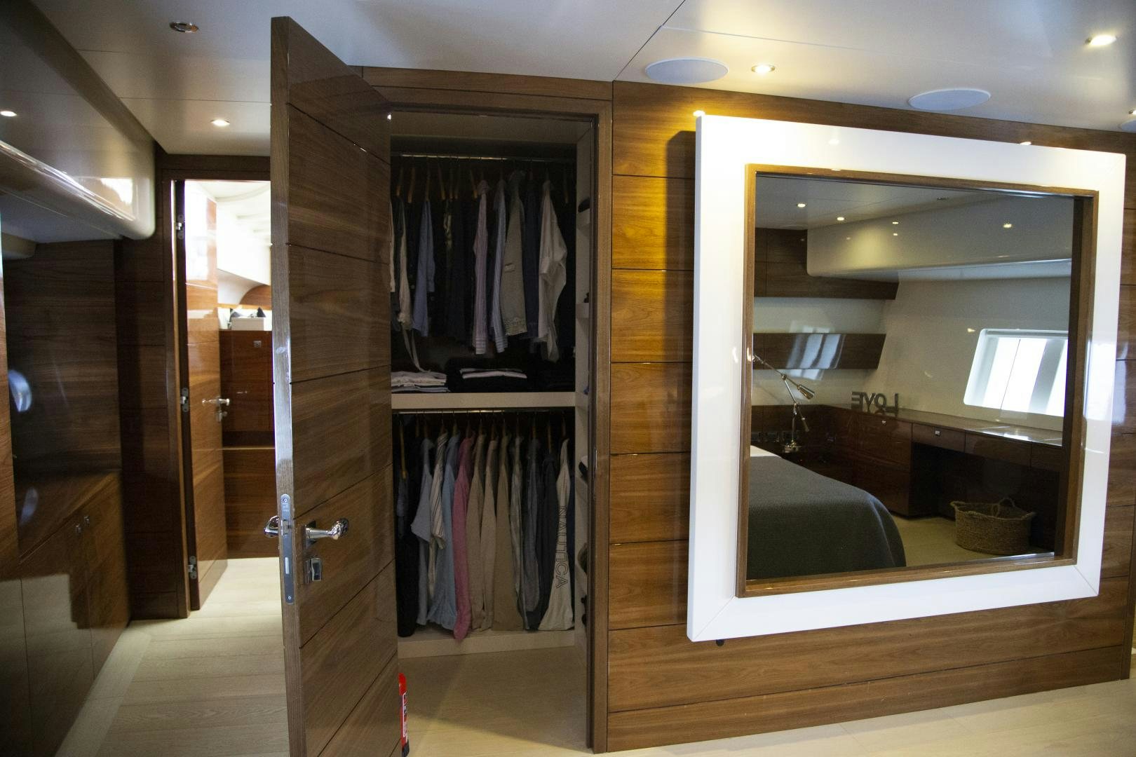 a closet with a mirror aboard MUSIC Yacht for Charter