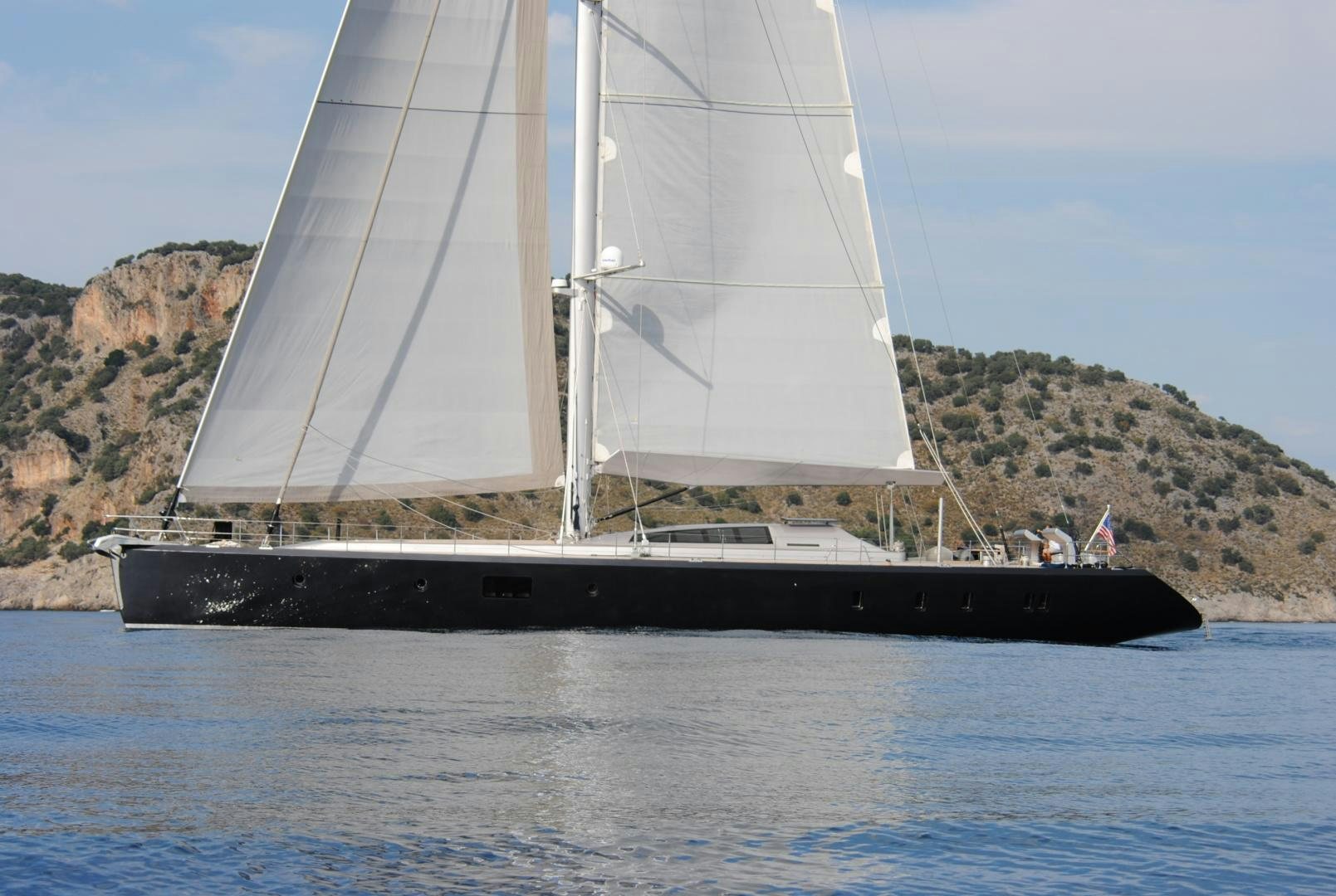 a large sailboat on the water aboard MUSIC Yacht for Sale