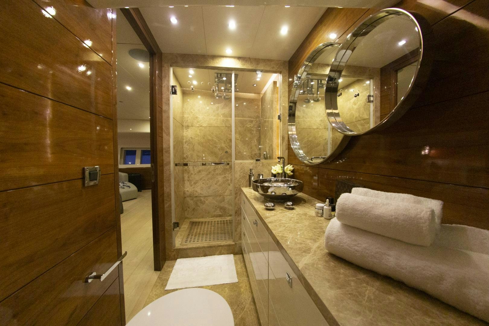 a bathroom with a large mirror aboard MUSIC Yacht for Charter