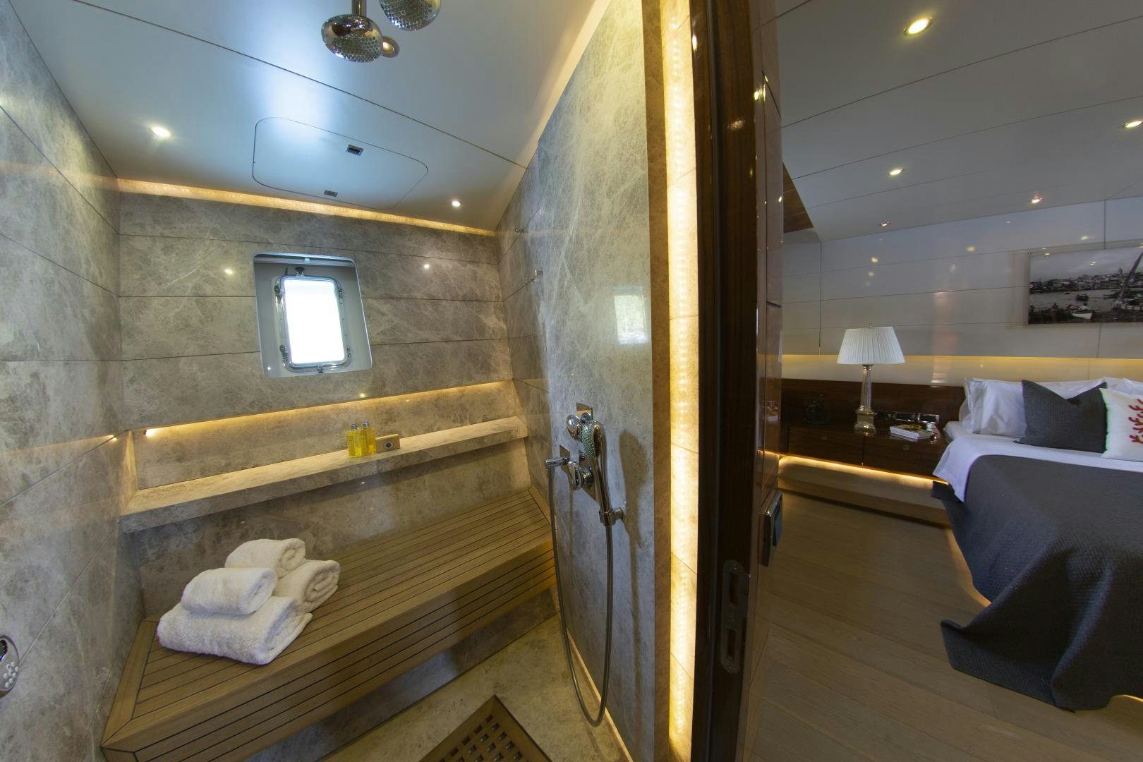 a room with a bed and a mirror aboard MUSIC Yacht for Sale