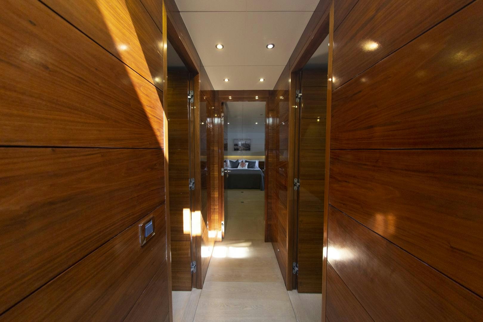 a hallway with wood walls aboard MUSIC Yacht for Charter