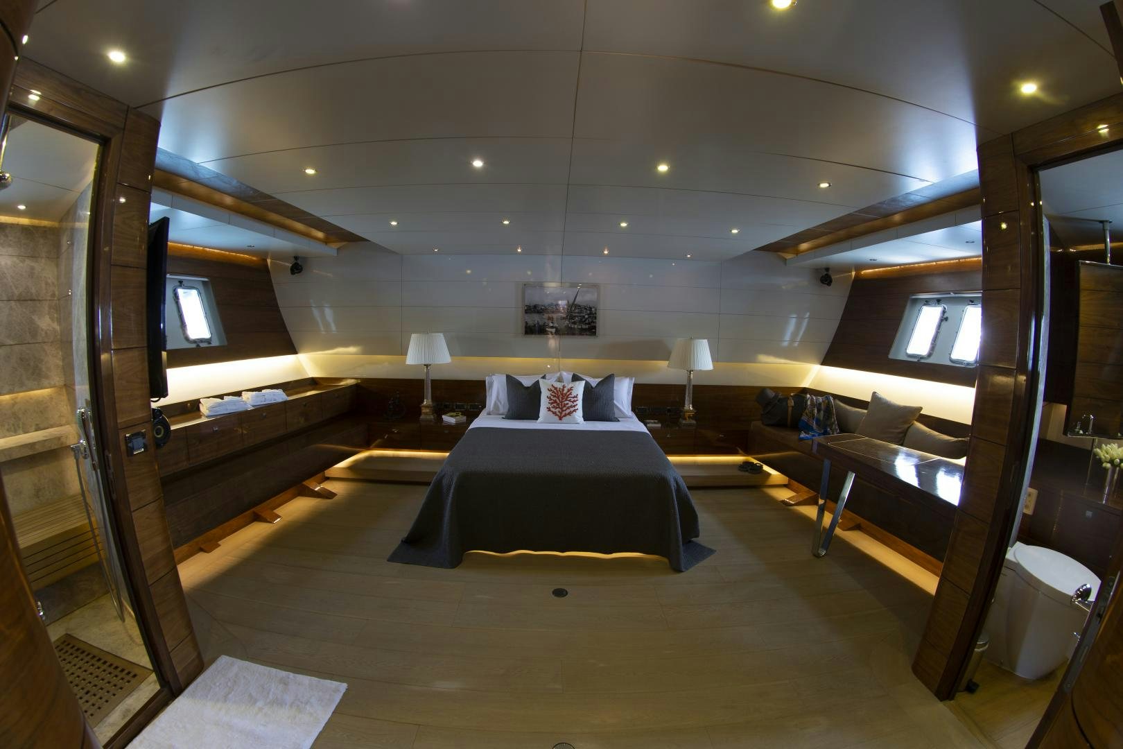 a room with a bed and a table aboard MUSIC Yacht for Sale