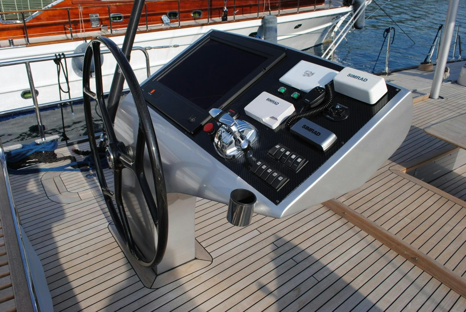 a large black and white machine on a deck aboard MUSIC Yacht for Sale