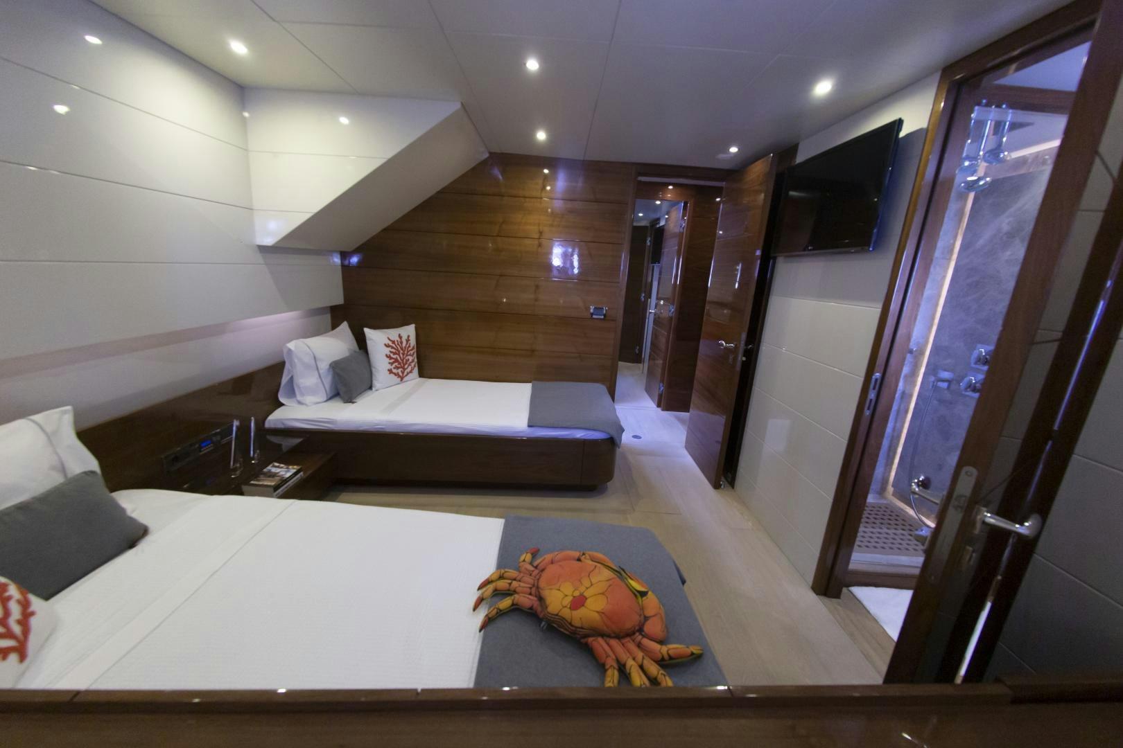 a room with a bed and a mirror aboard MUSIC Yacht for Sale