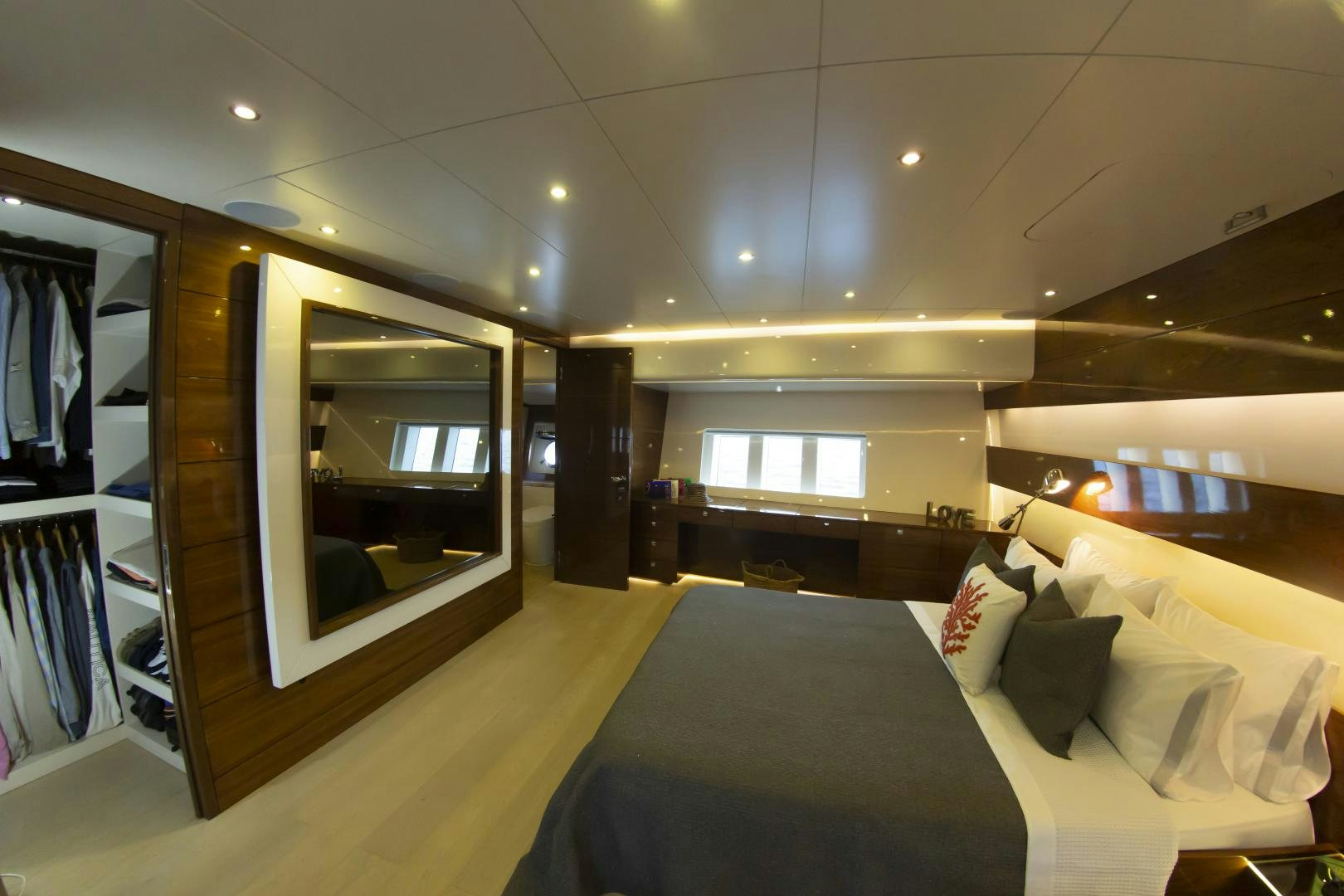 a room with a bed and a mirror aboard MUSIC Yacht for Sale