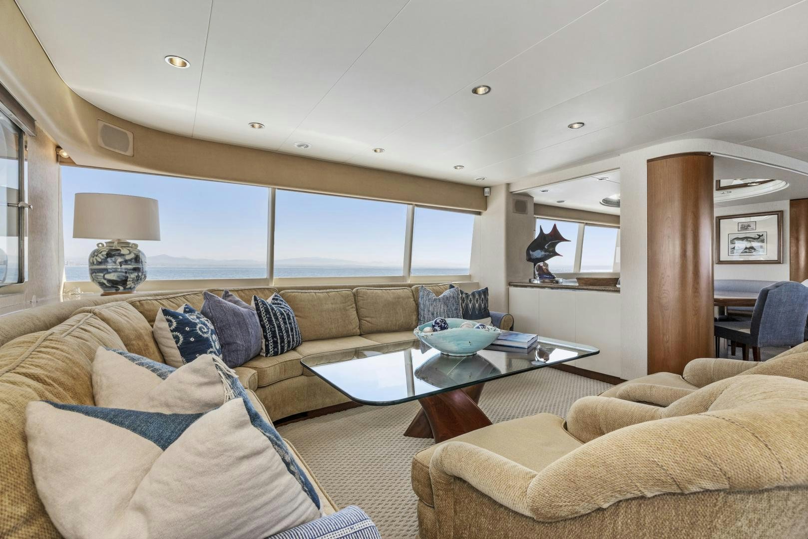 a living room with a couch and a coffee table aboard AQUILA Yacht for Sale