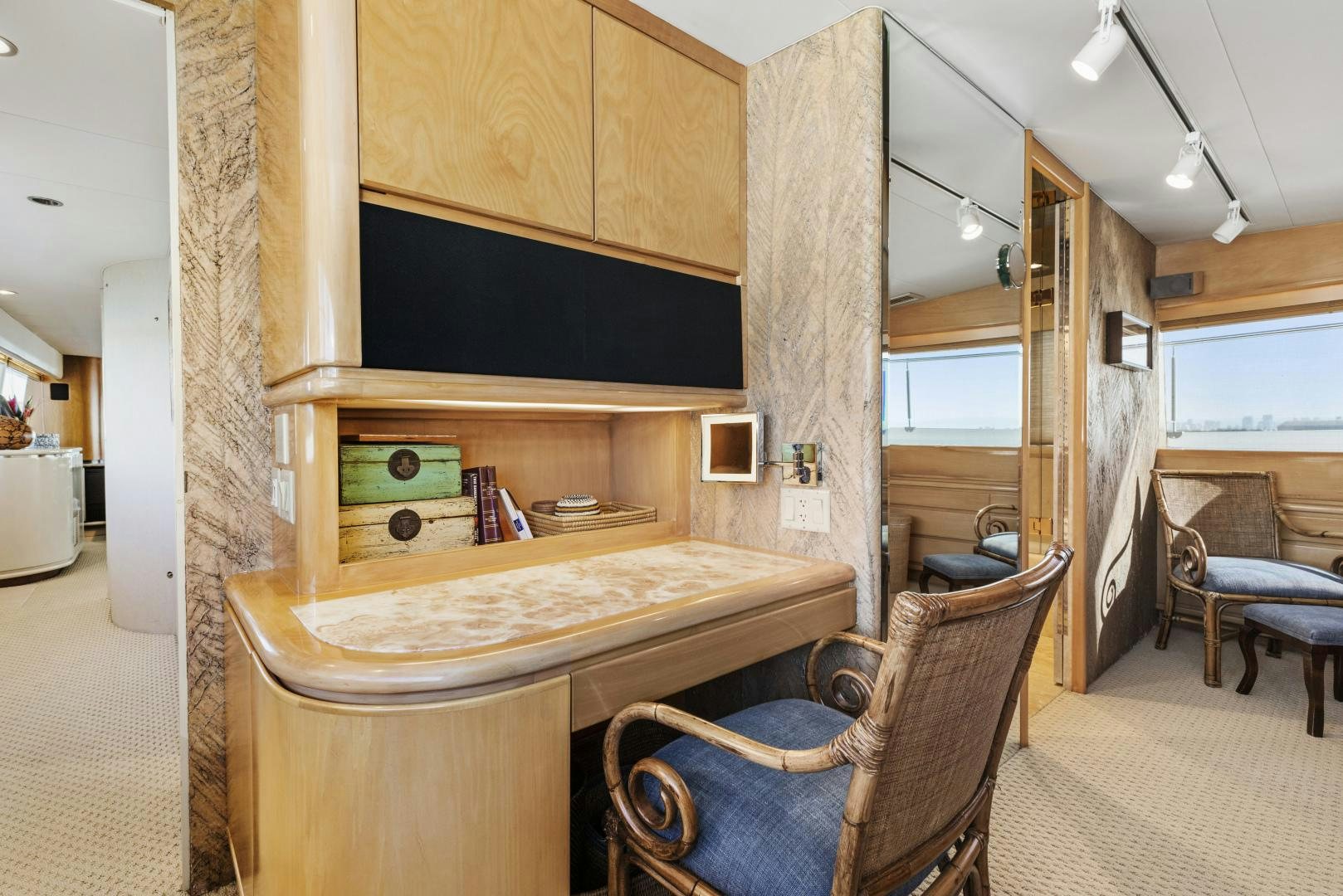 a room with a table and chairs aboard AQUILA Yacht for Sale