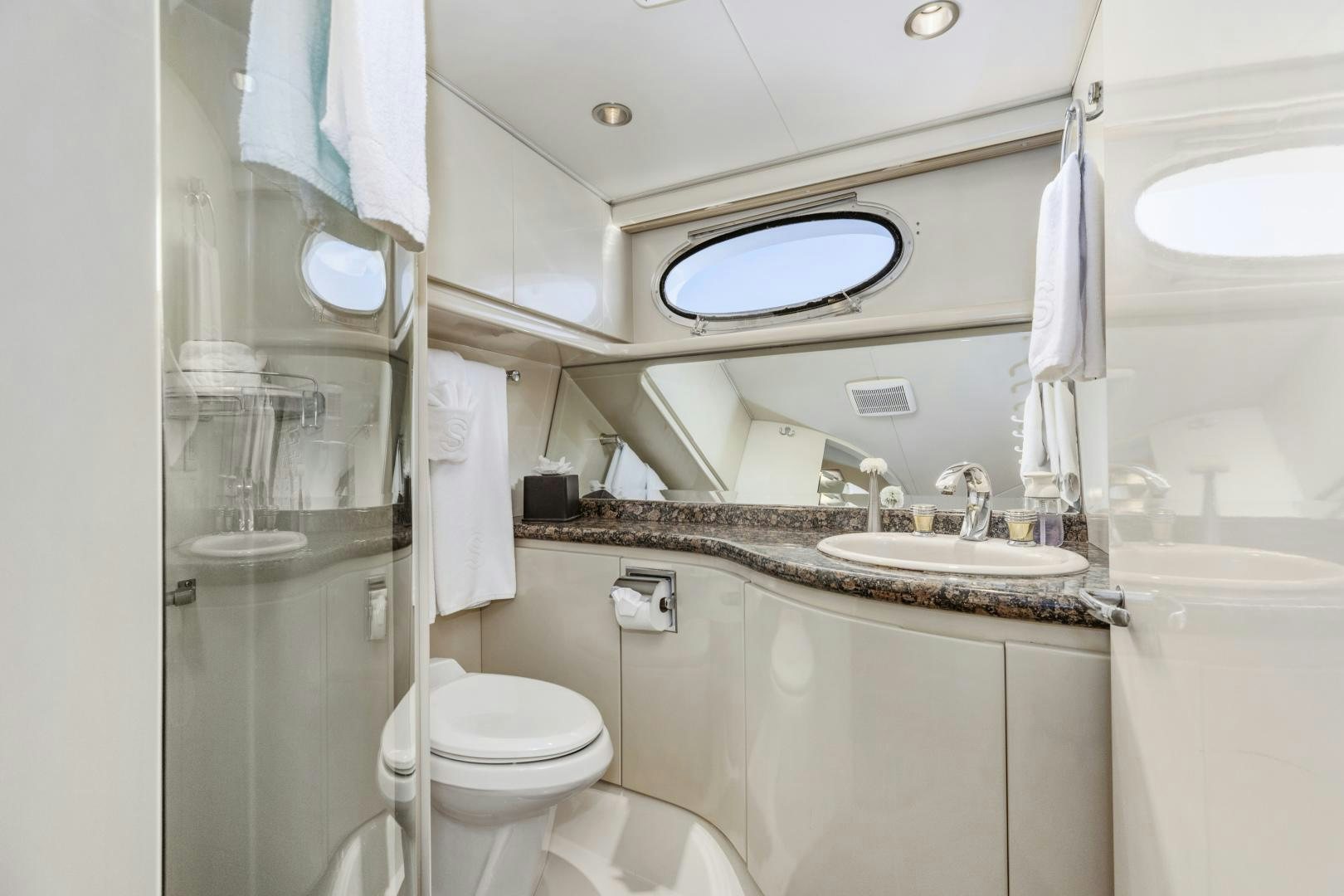 a bathroom with a sink toilet and a shower aboard AQUILA Yacht for Sale