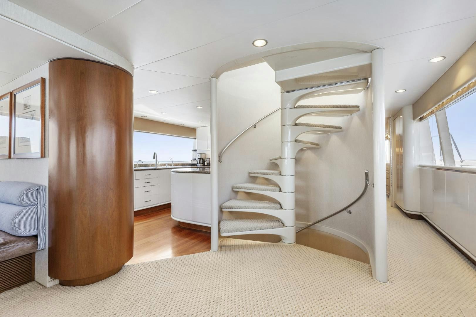 a white staircase in a house aboard AQUILA Yacht for Sale