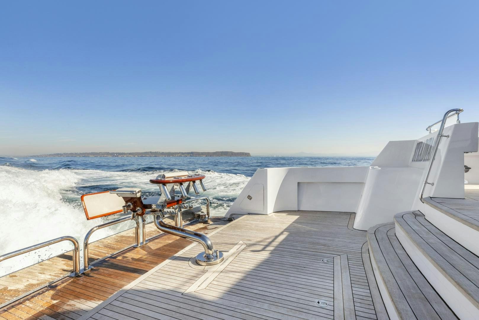 a deck with a boat on it aboard AQUILA Yacht for Sale
