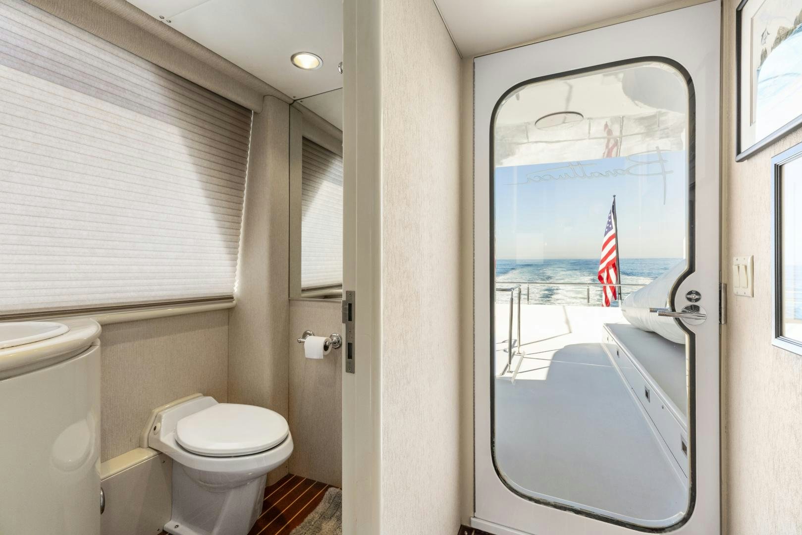 a bathroom with a large window aboard AQUILA Yacht for Sale