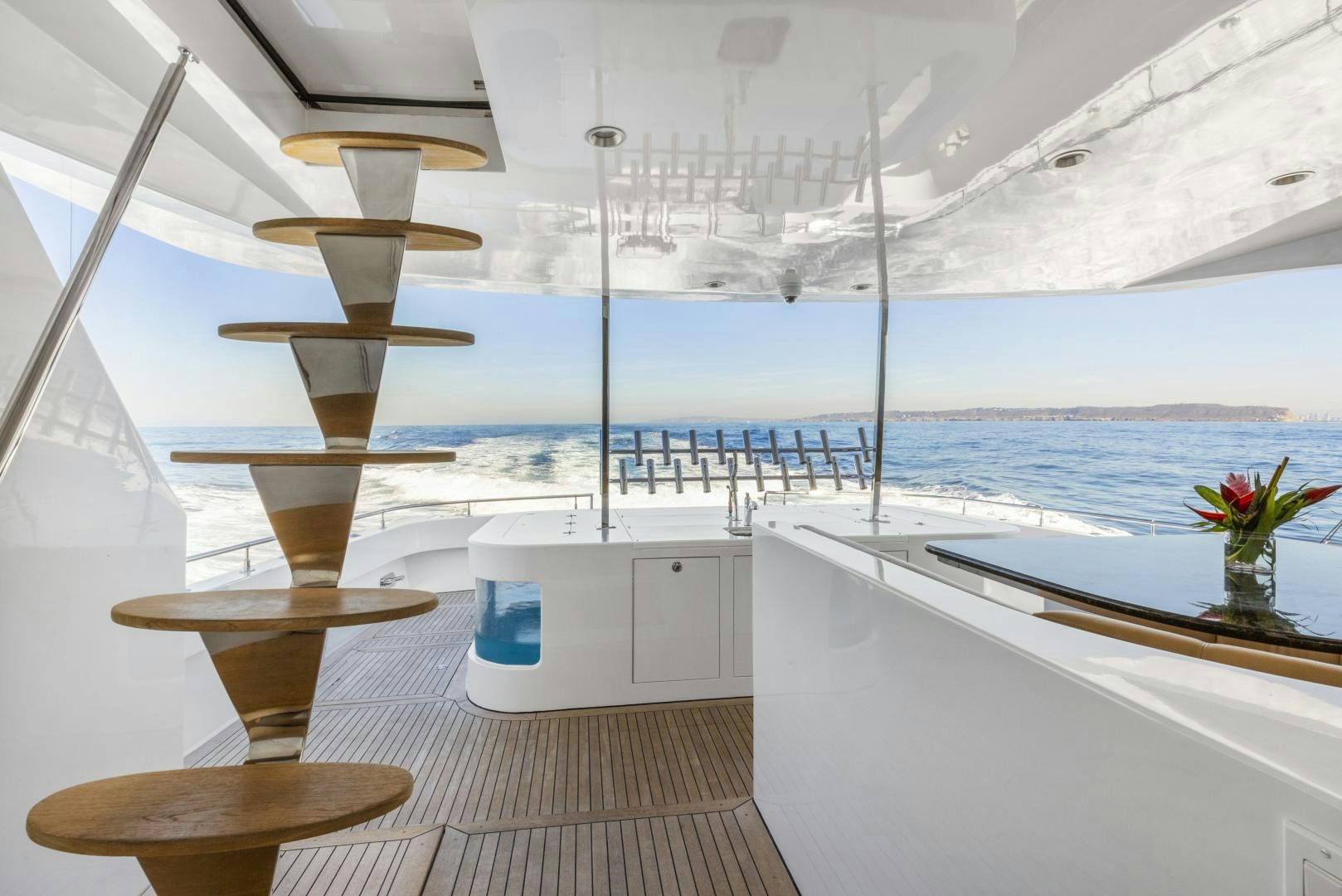 a room with a table and chairs aboard AQUILA Yacht for Sale