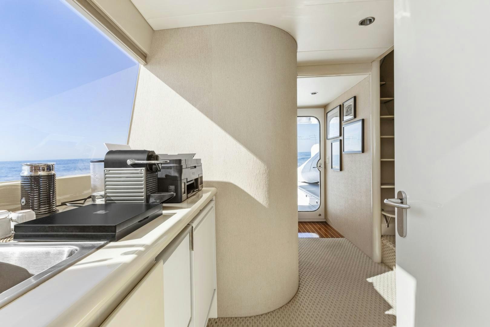 a kitchen with a sink and a window aboard AQUILA Yacht for Sale