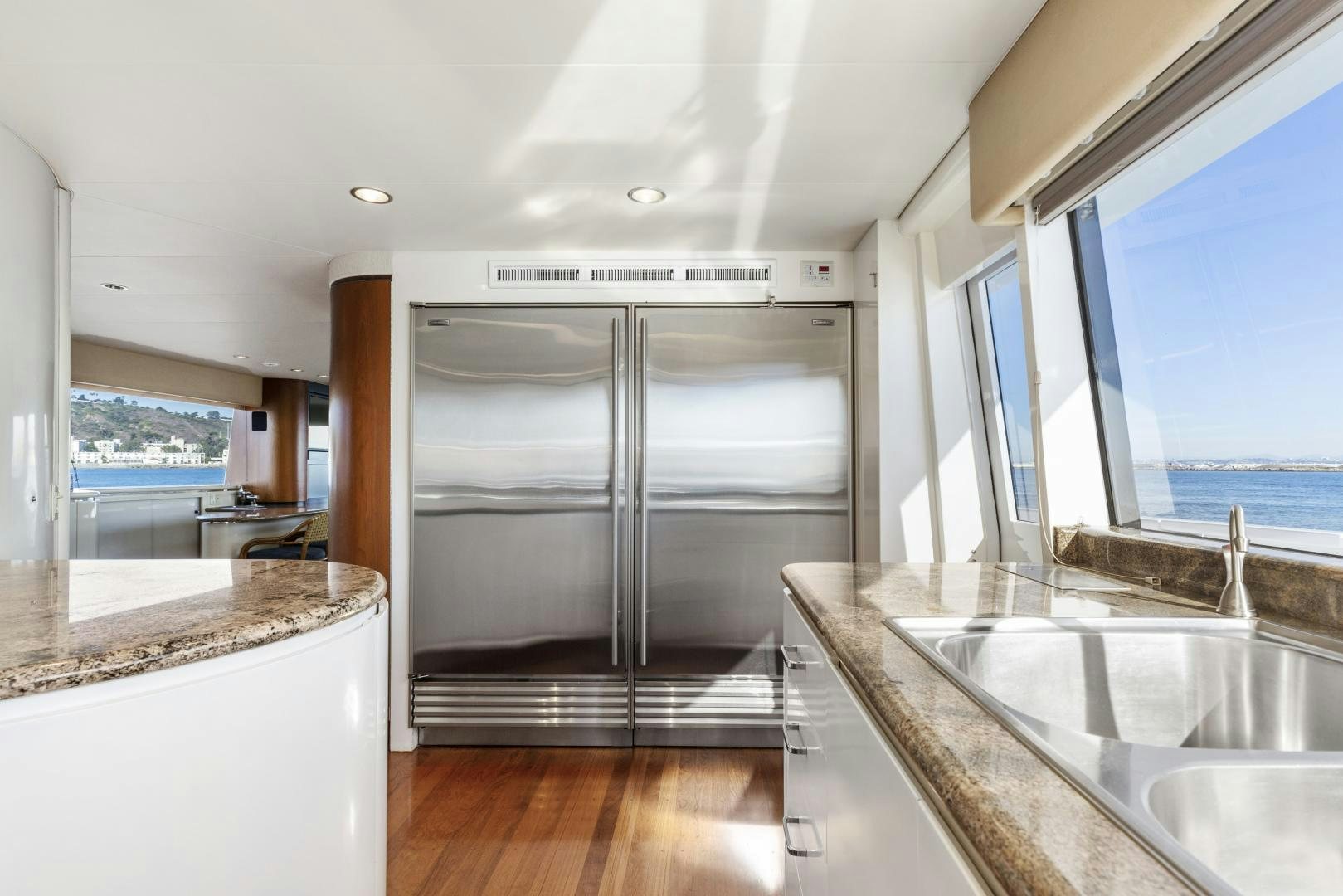 a kitchen with a large glass shower aboard AQUILA Yacht for Sale