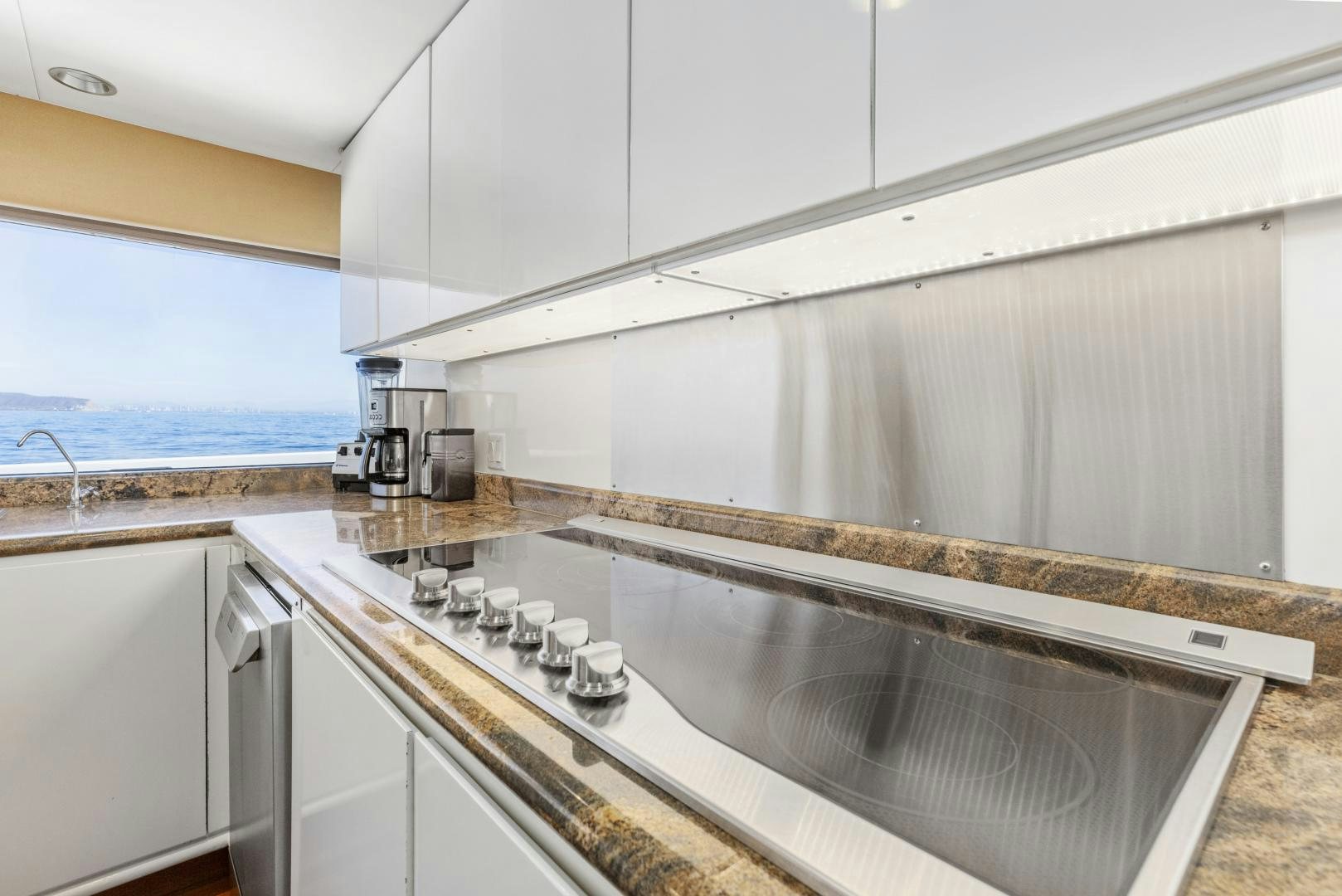 a kitchen with a sink and a window aboard AQUILA Yacht for Sale