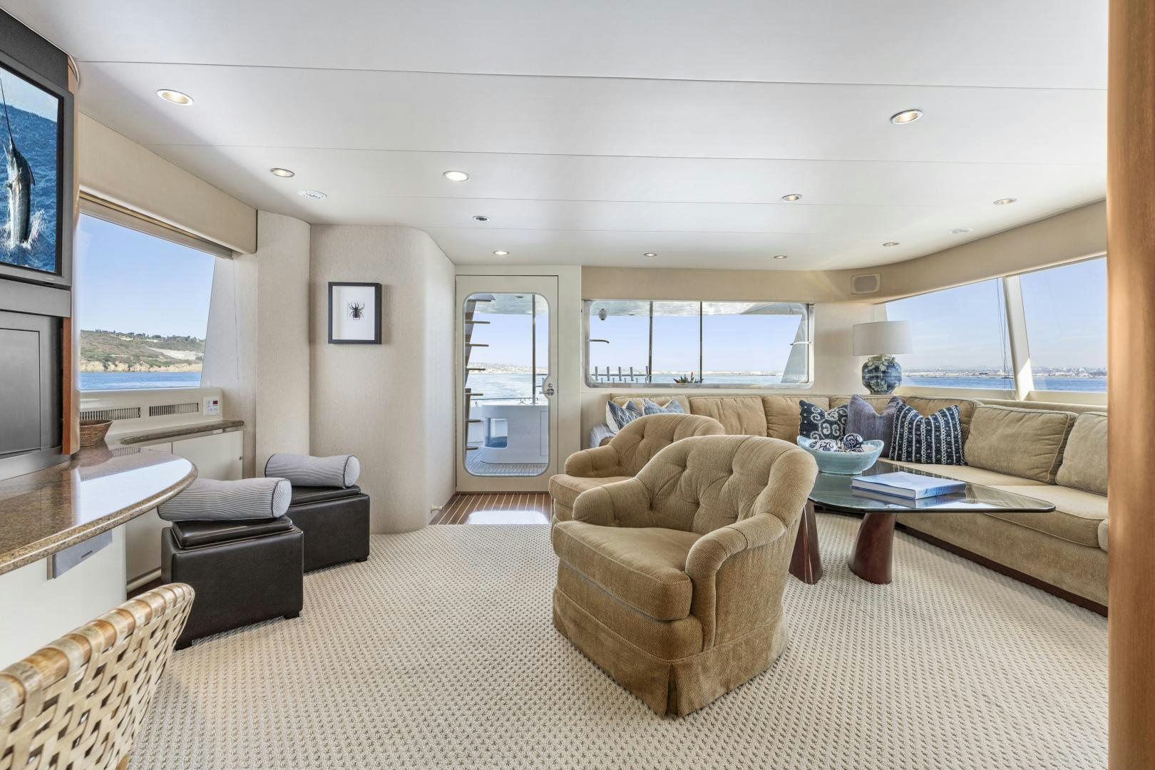 a living room with a large window aboard AQUILA Yacht for Sale
