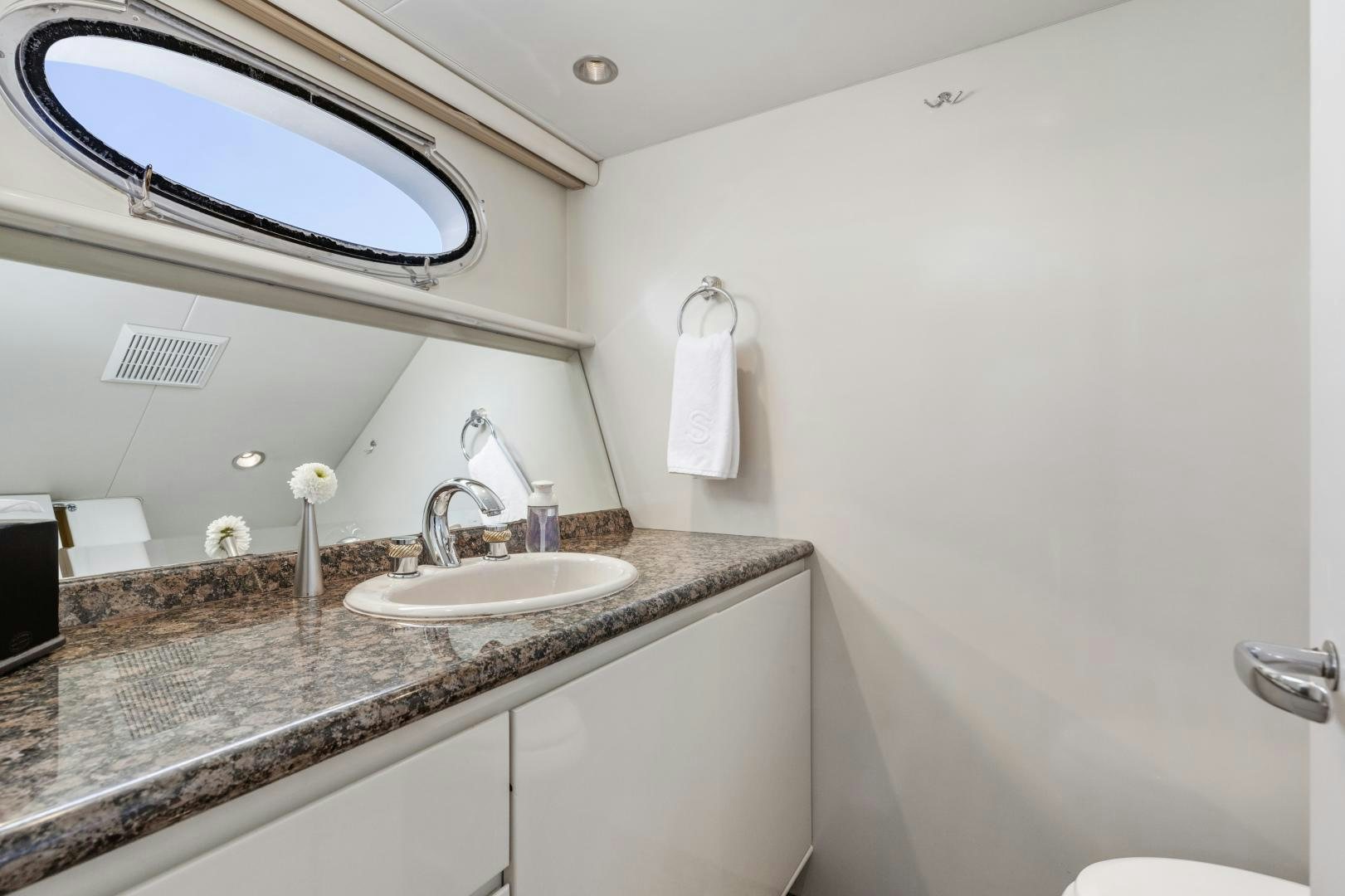 a bathroom with a marble countertop aboard AQUILA Yacht for Sale