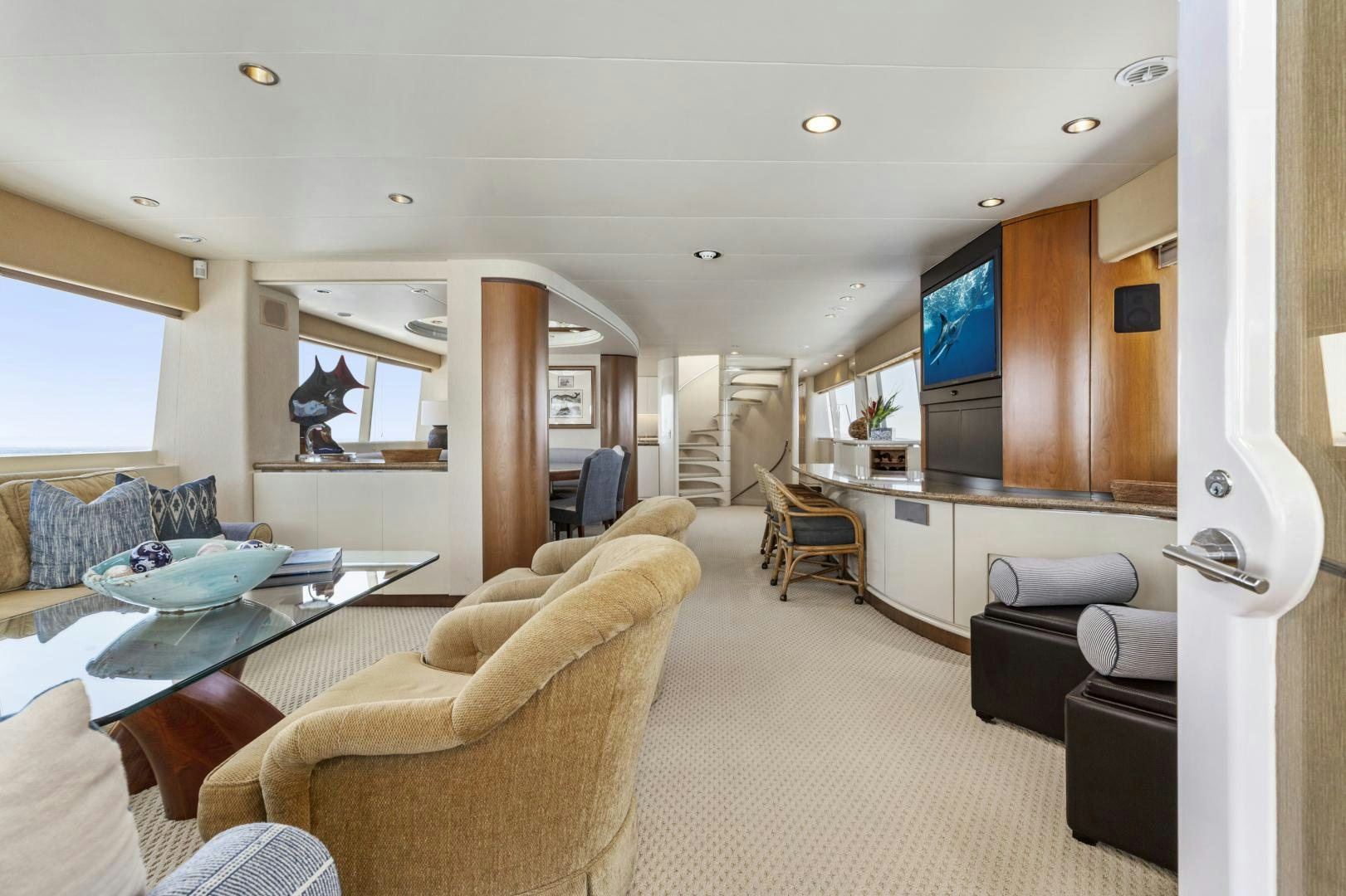 a living room with a kitchen and living room aboard AQUILA Yacht for Sale