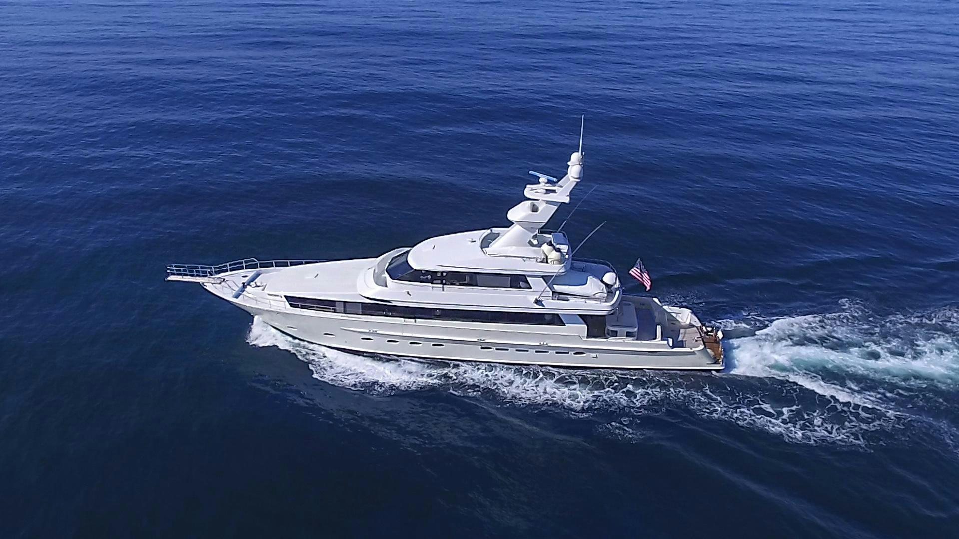 a white yacht in the ocean aboard AQUILA Yacht for Sale