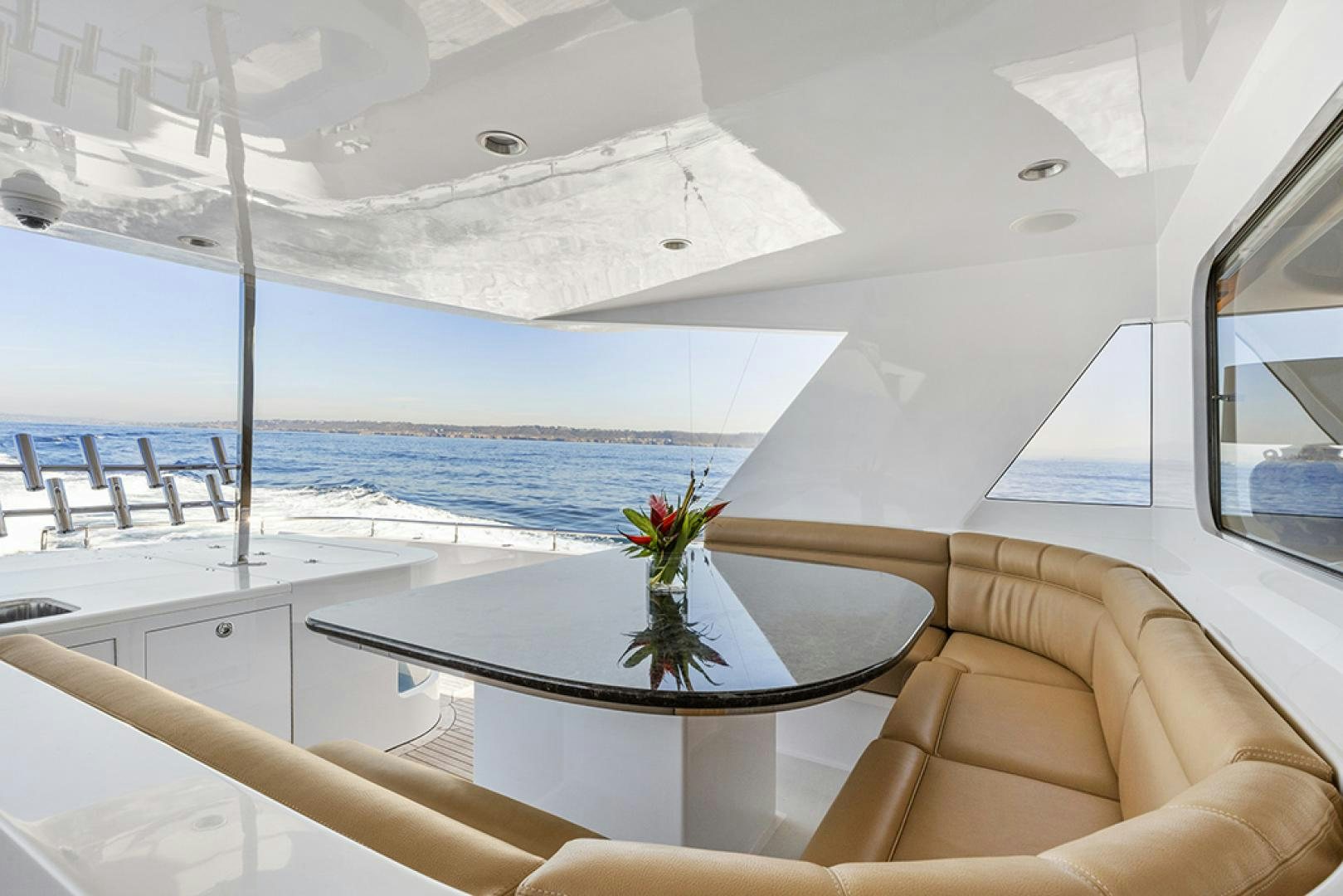a room with a table and chairs aboard AQUILA Yacht for Sale