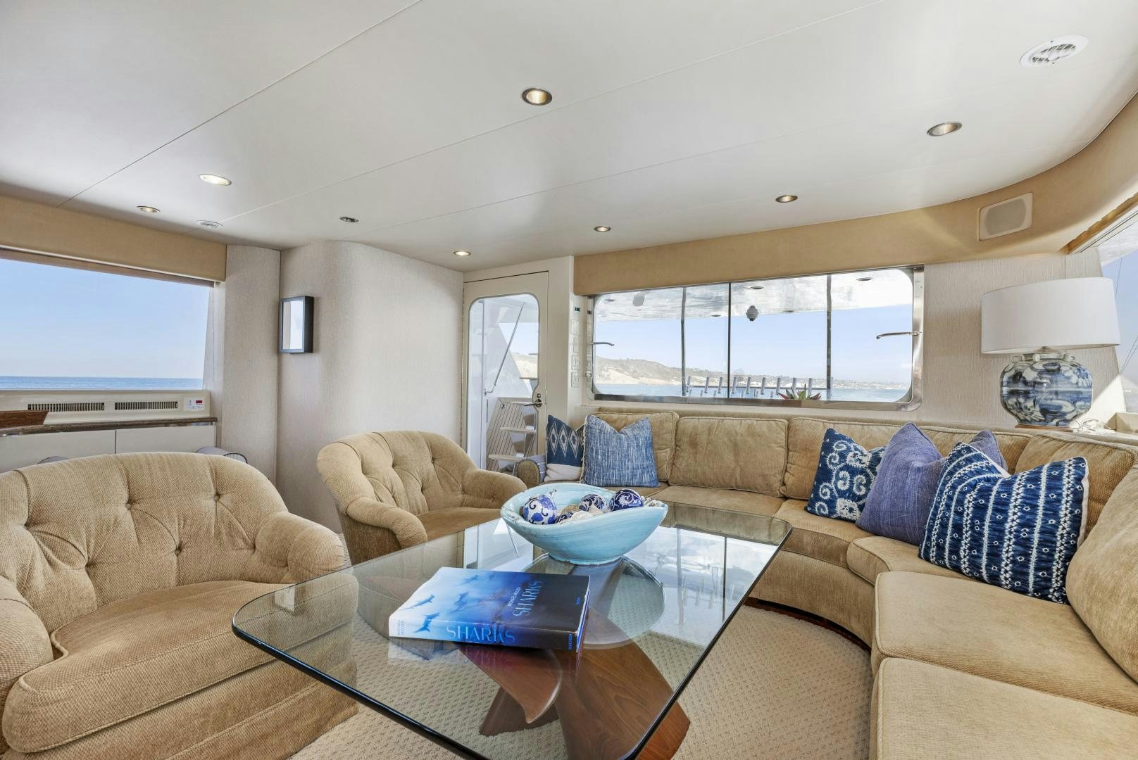 a living room with a couch and a coffee table aboard AQUILA Yacht for Sale