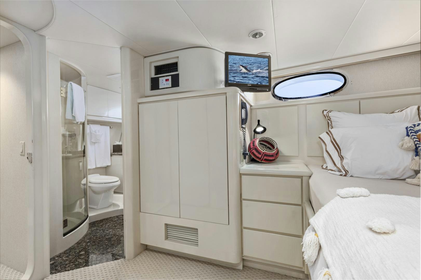 a small white bathroom aboard AQUILA Yacht for Sale