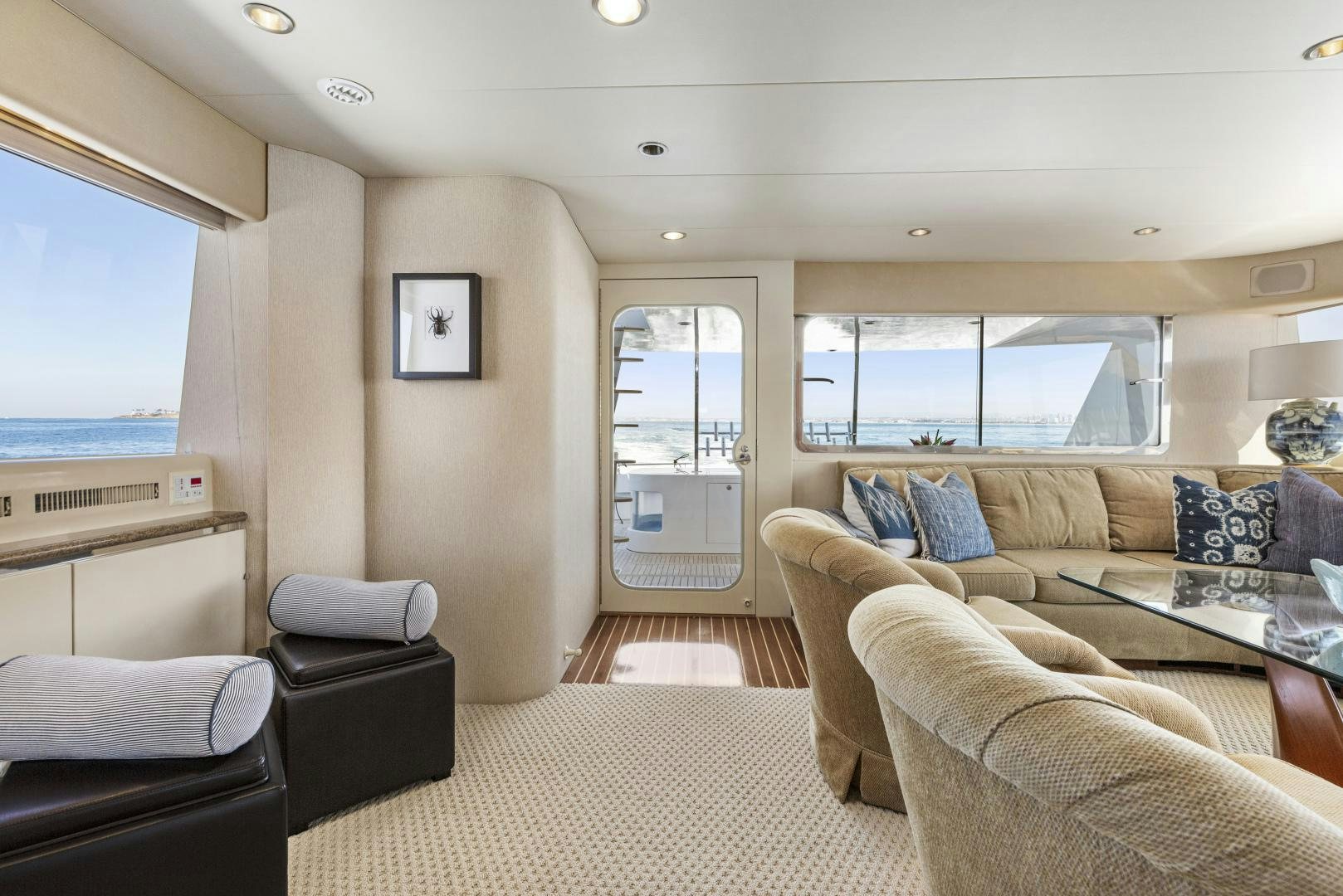 a living room with a couch and a window aboard AQUILA Yacht for Sale