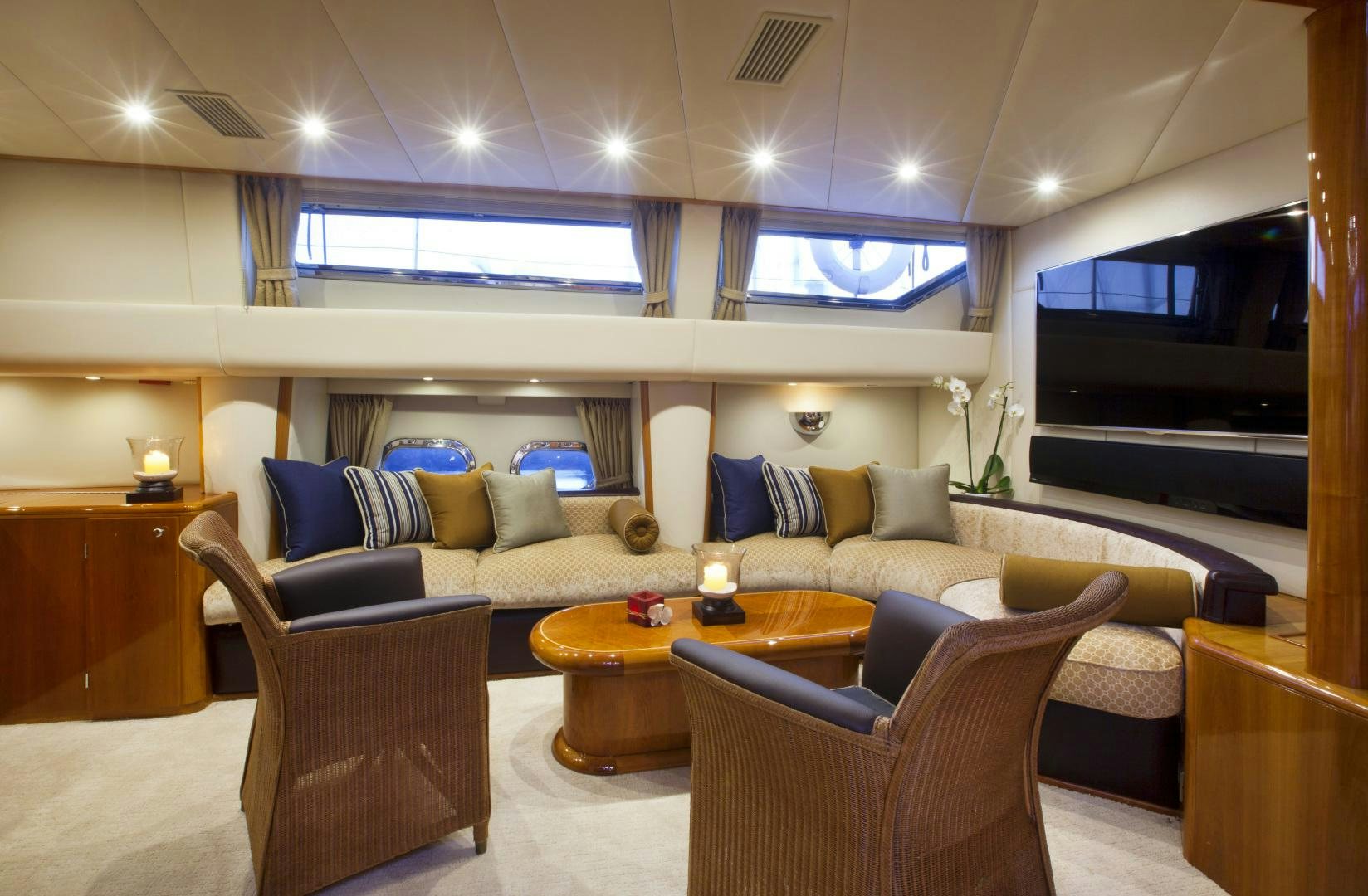 a living room with a couch and a table aboard REE Yacht for Sale