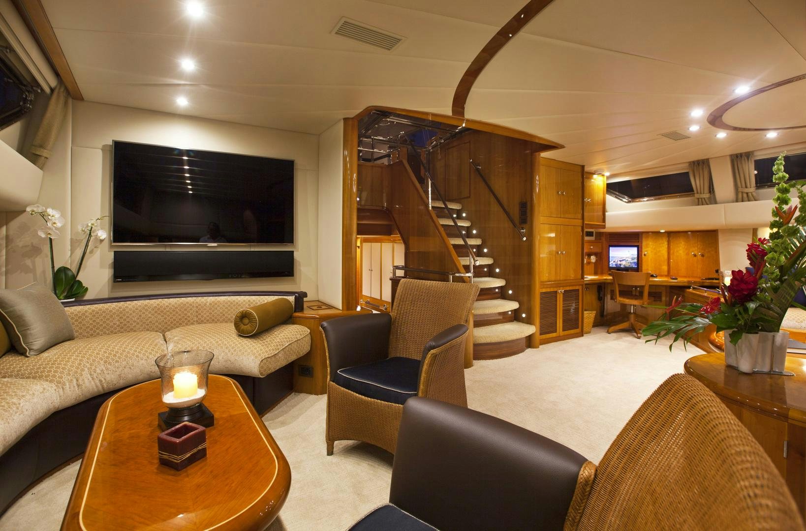 a living room with a fireplace aboard REE Yacht for Sale