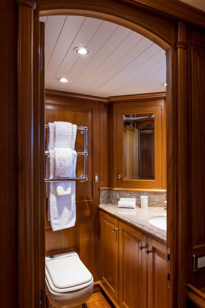 a bathroom with a toilet and a sink aboard BLUE TOO Yacht for Sale