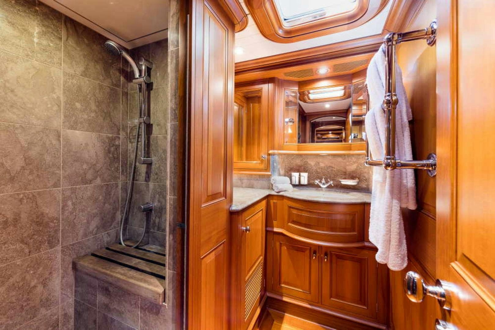 a bathroom with a sink and a mirror aboard BLUE TOO Yacht for Sale