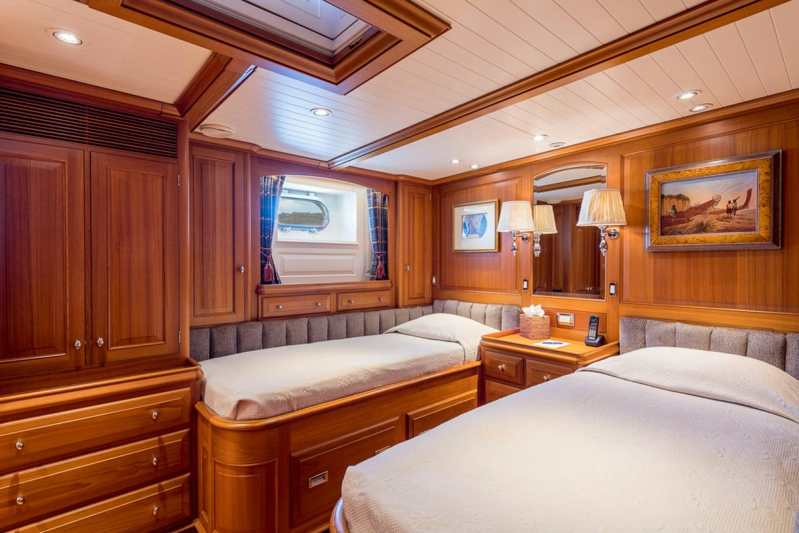 a bedroom with two beds aboard BLUE TOO Yacht for Sale