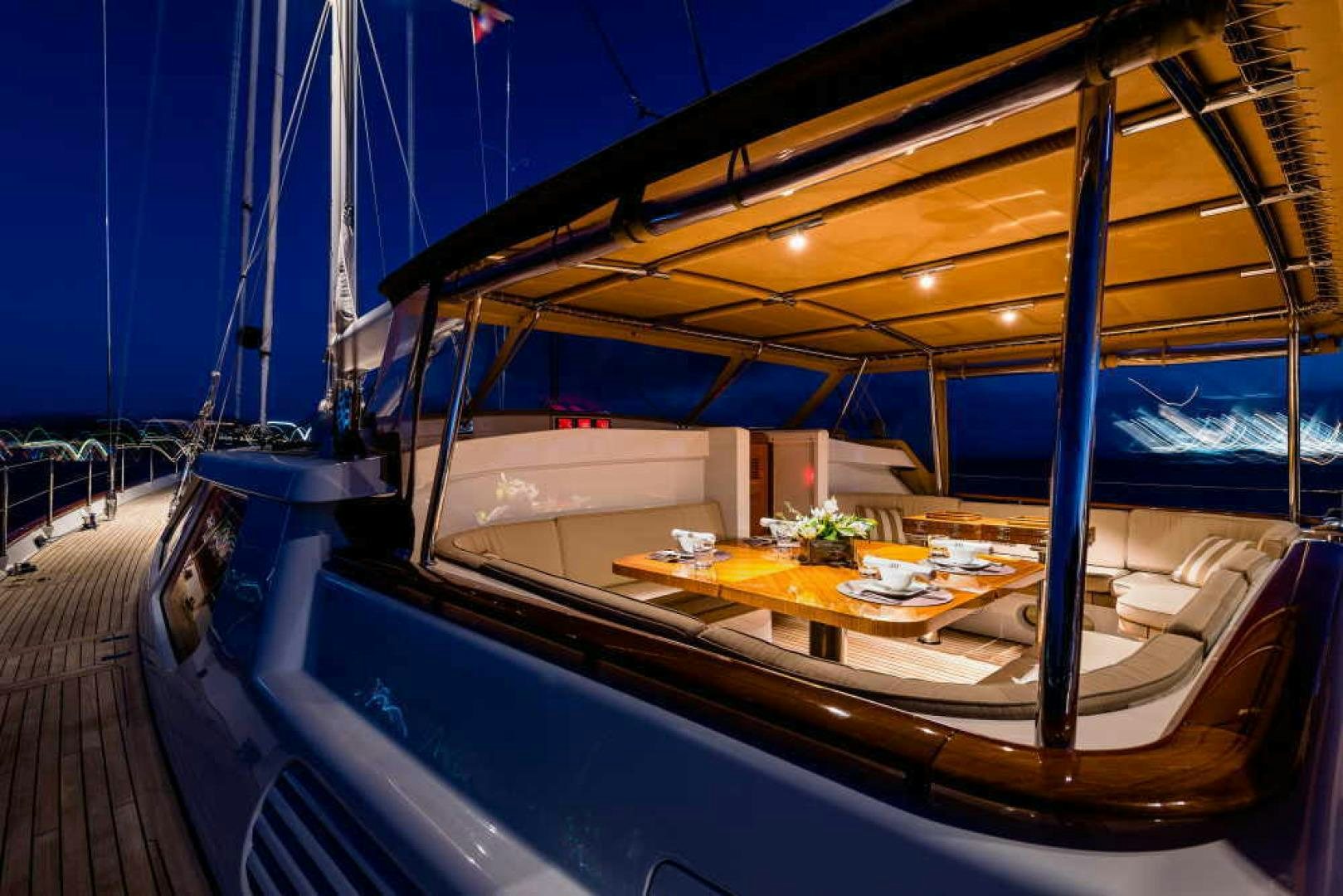 a boat with a table and chairs aboard BLUE TOO Yacht for Sale