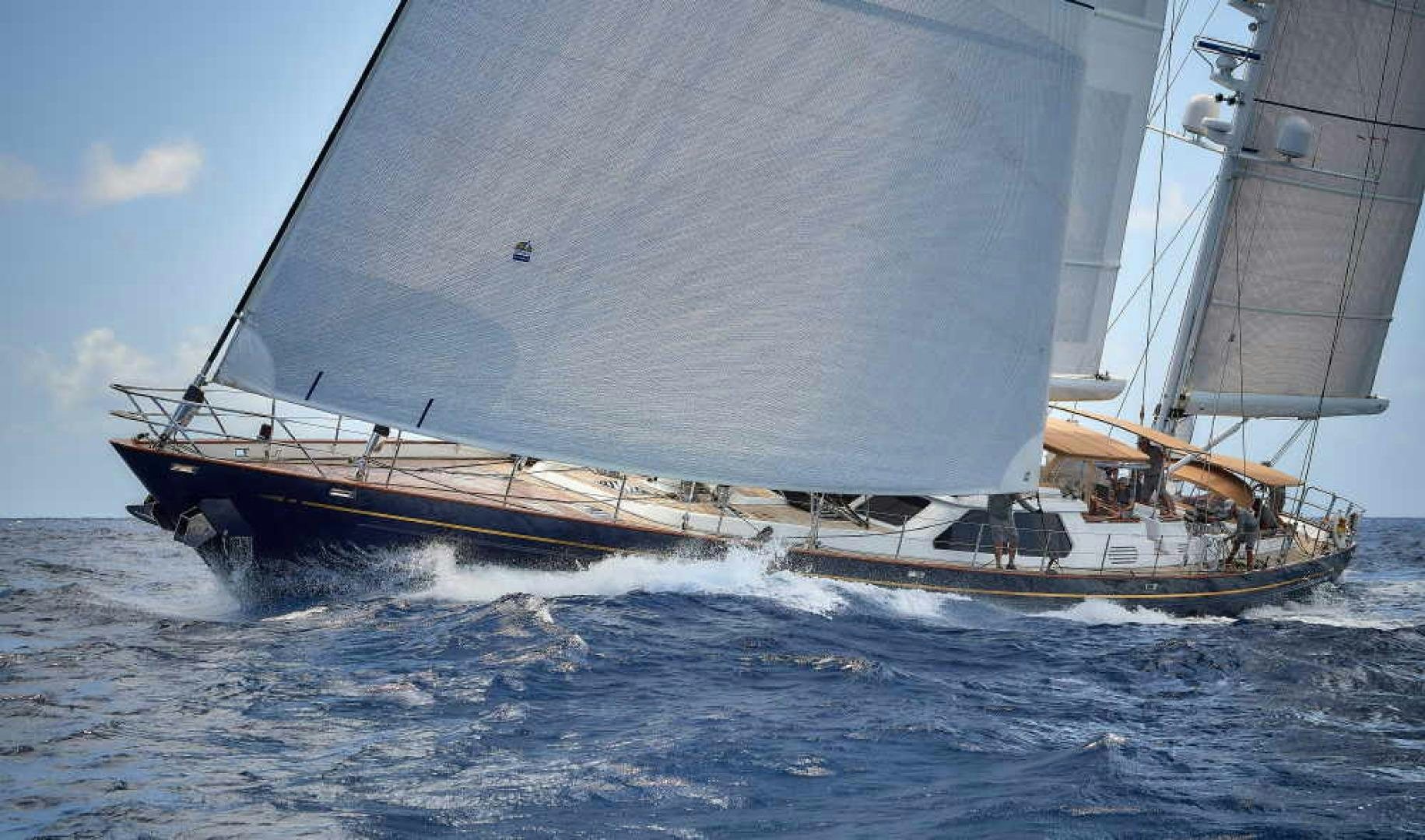 a boat sailing on the sea aboard BLUE TOO Yacht for Sale