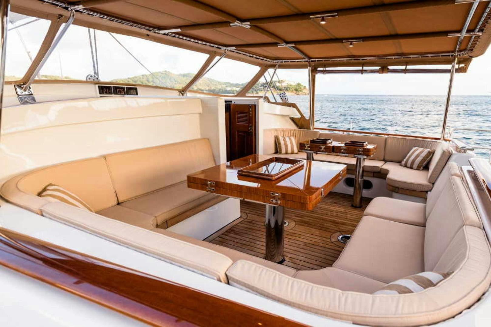 a boat with a table and chairs aboard BLUE TOO Yacht for Sale