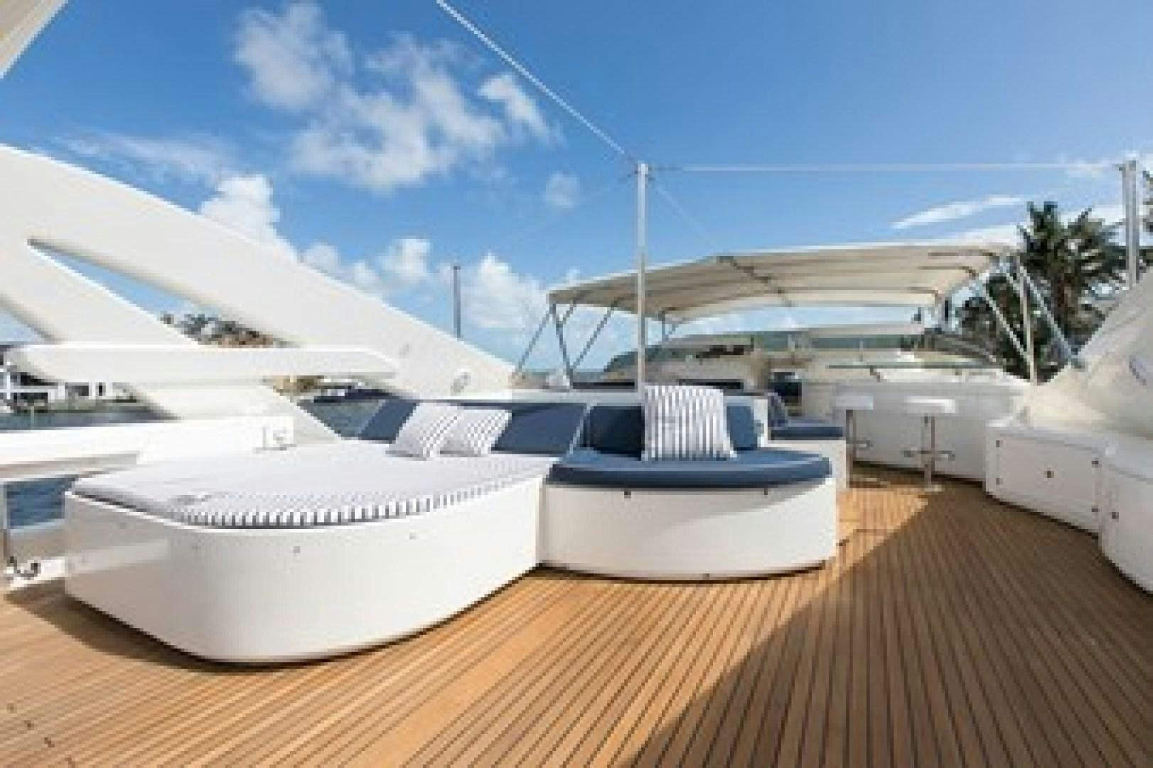 a deck with white yachts aboard MAMBO Yacht for Sale