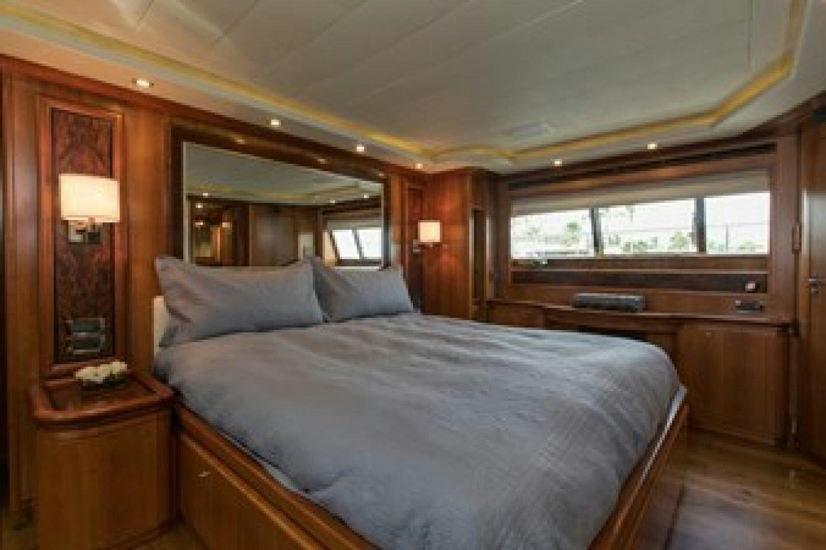 a bed in a room aboard MAMBO Yacht for Sale