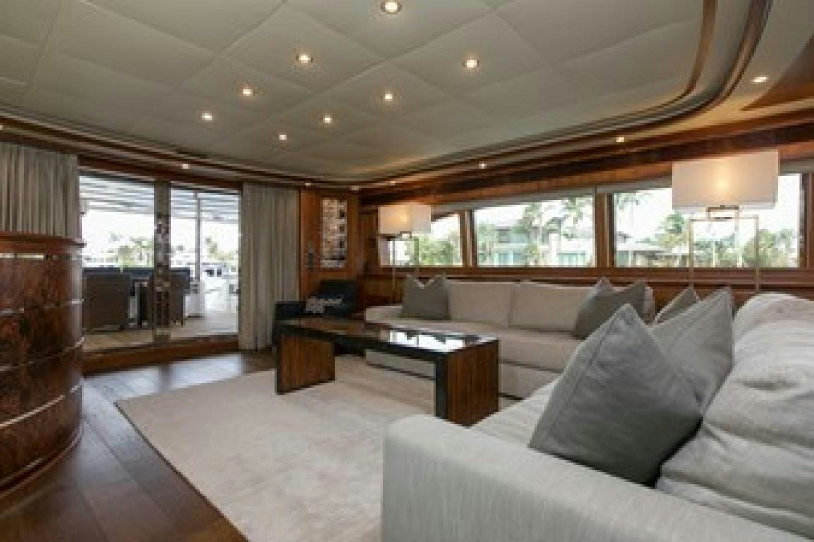 a living room with a large window aboard MAMBO Yacht for Sale