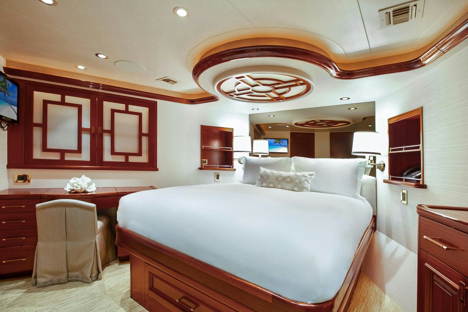 a bedroom with a large bed aboard NAUTI N' Yacht for Sale